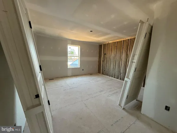 a view of a room with wooden walls