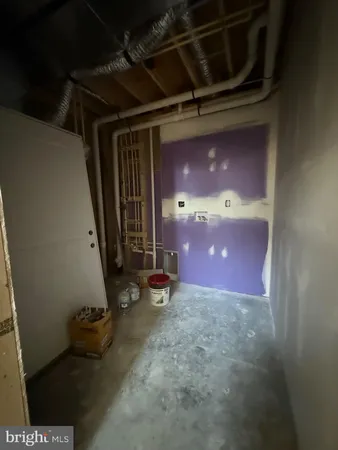 a view of a livingroom with an empty space and window