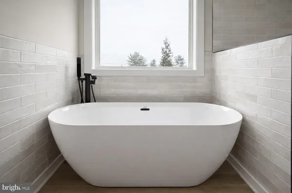a view of a bathtub in bathroom
