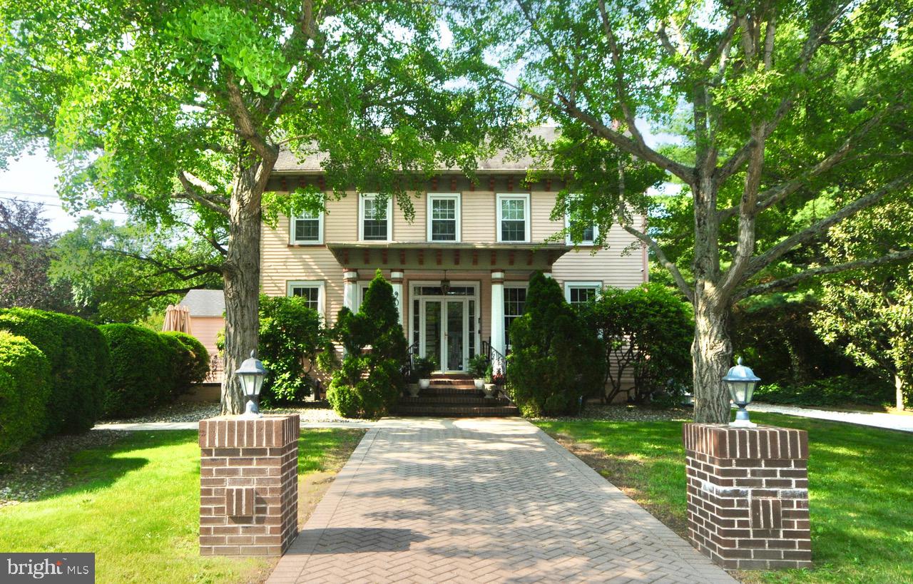 9087 Highland Street Mauricetown, NJ 08329 - Photo 1 of 48 a front view of a house with a garden