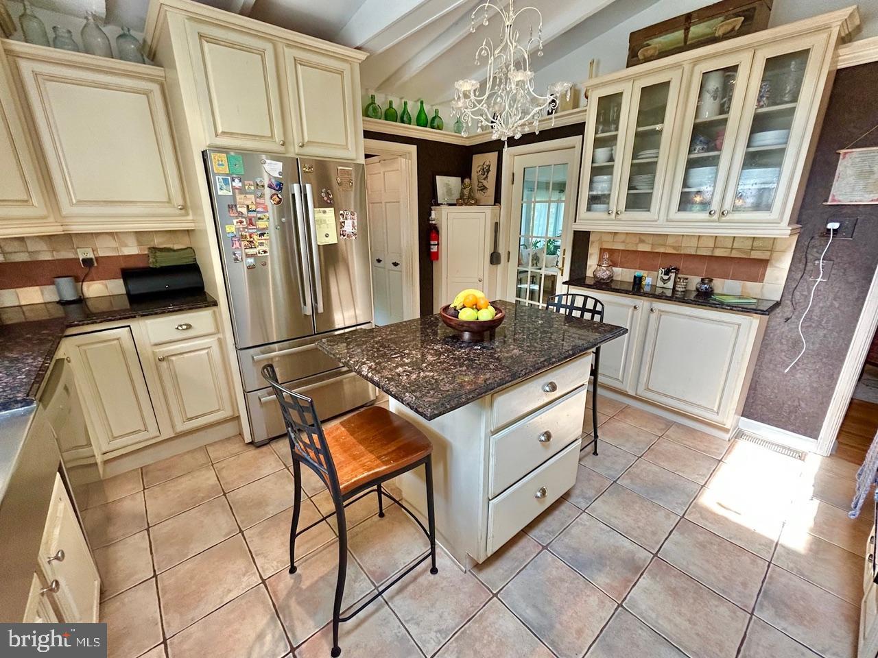 9087 Highland Street Mauricetown, NJ 08329 - Photo 12 of 48 a kitchen with stainless steel appliances granite countertop a stove and a refrigerator