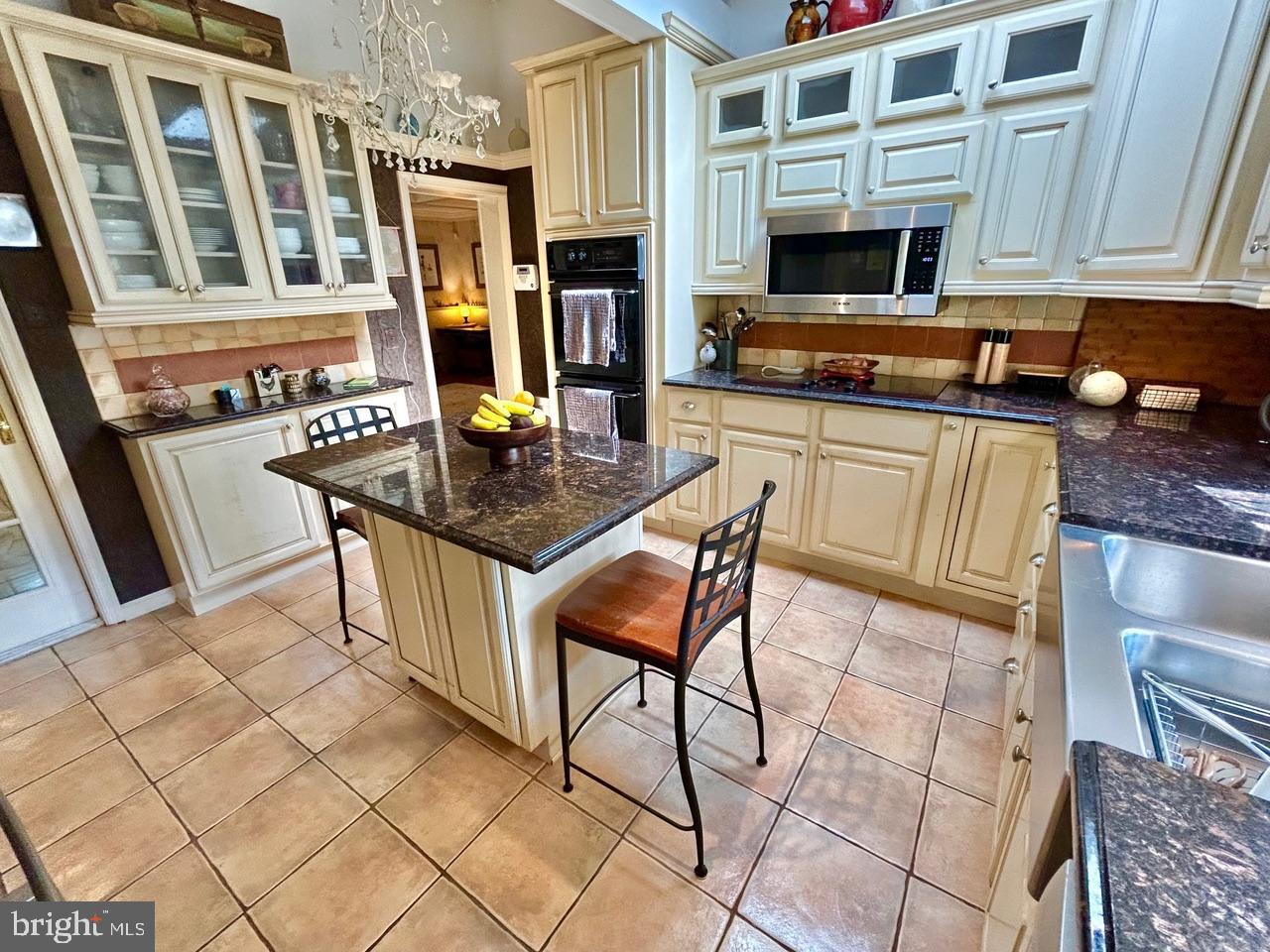 9087 Highland Street Mauricetown, NJ 08329 - Photo 13 of 48 a kitchen with stainless steel appliances granite countertop a stove a sink and a microwave