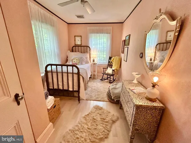 a bedroom with a bed and a dresser in it