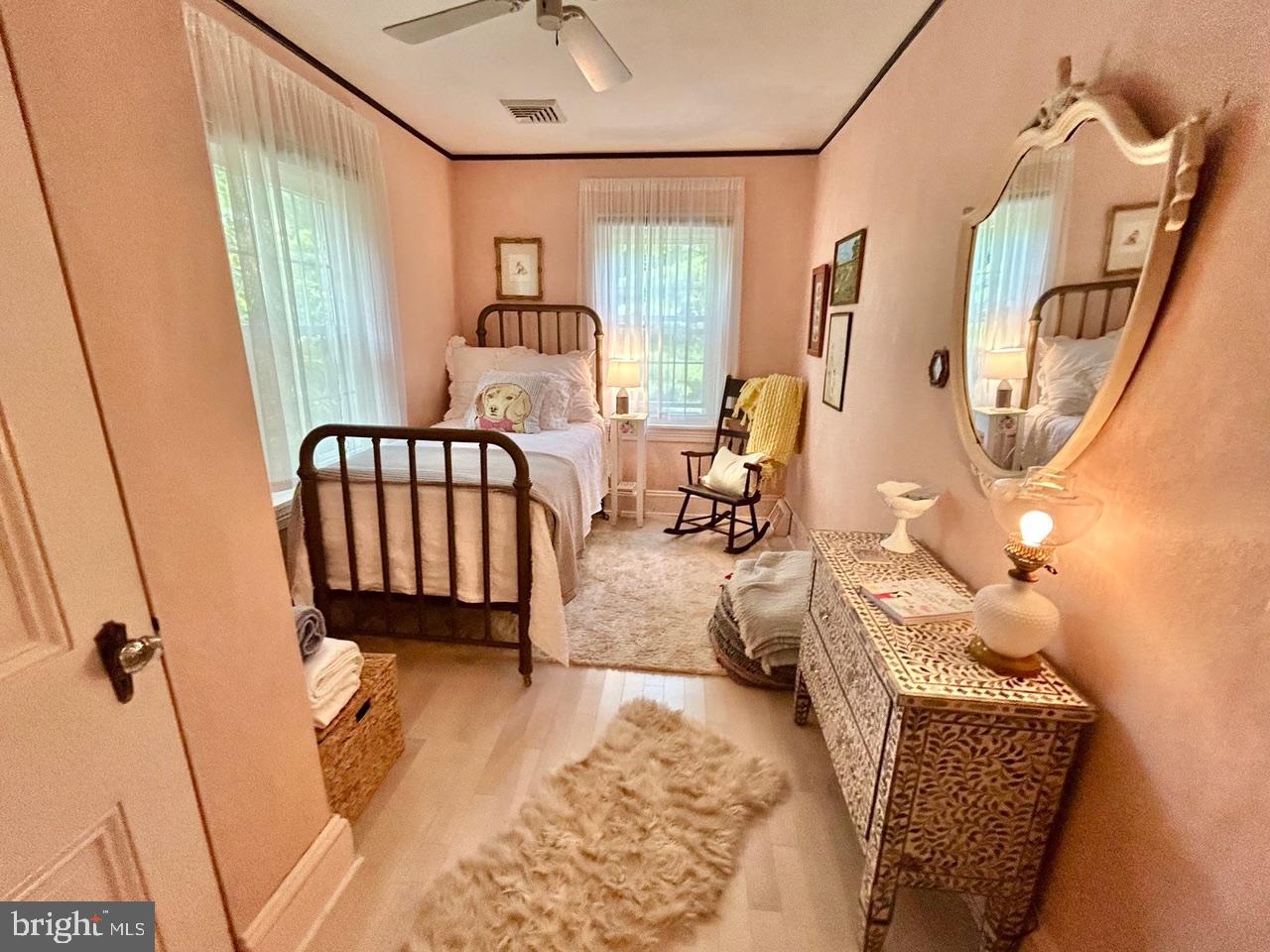 9087 Highland Street Mauricetown, NJ 08329 - Photo 18 of 48 a bedroom with furniture and a window