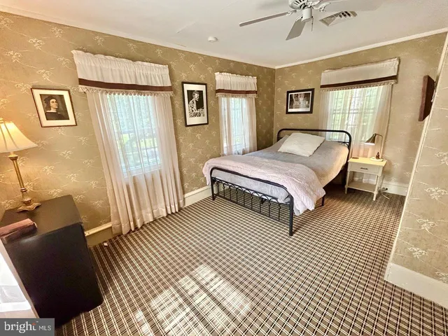 a bathroom with a sink toilet and mirror