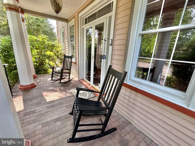 a view of a two chairs in the balcony