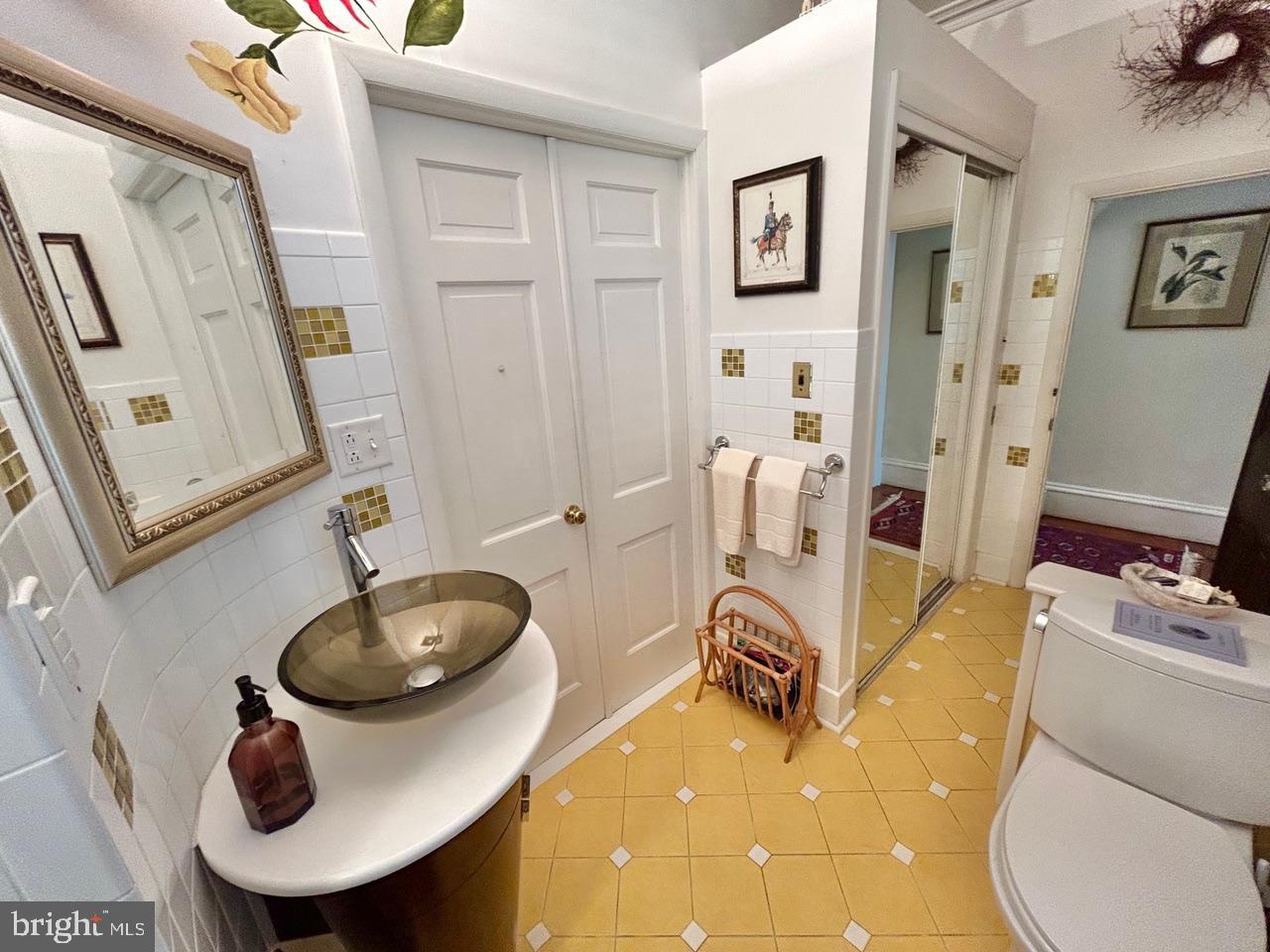 9087 Highland Street Mauricetown, NJ 08329 - Photo 23 of 48 a bathroom with a sink toilet and mirror