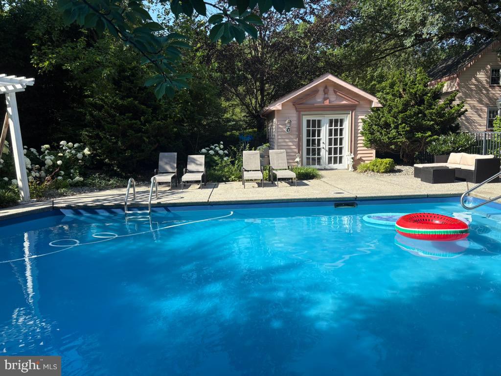 9087 Highland Street Mauricetown, NJ 08329 - Photo 33 of 48 a front view of a house with swimming pool having outdoor seating