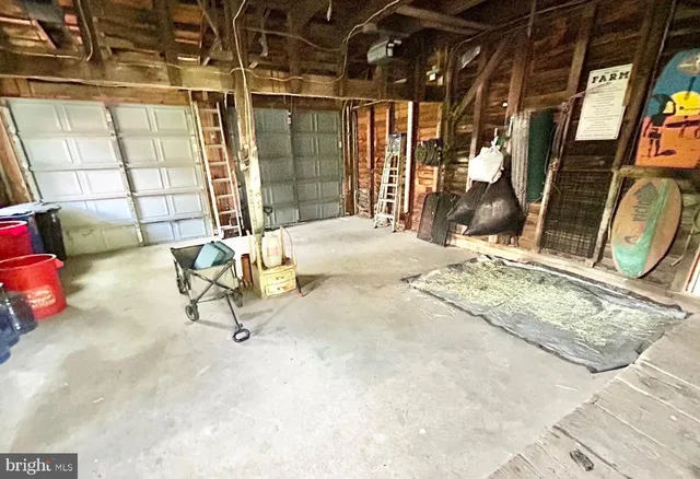 a dining room with wooden floor a chandelier