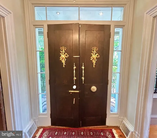 a kitchen with stainless steel appliances granite countertop a stove and a refrigerator