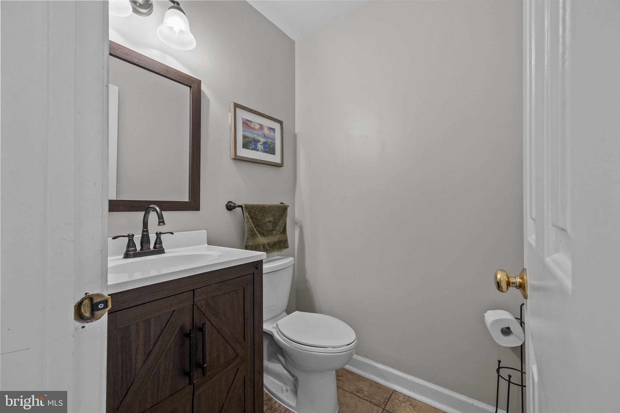 275 West Sandy Ridge Road Doylestown, PA 18901 - Photo 15 of 54 a bathroom with a sink a toilet and mirror