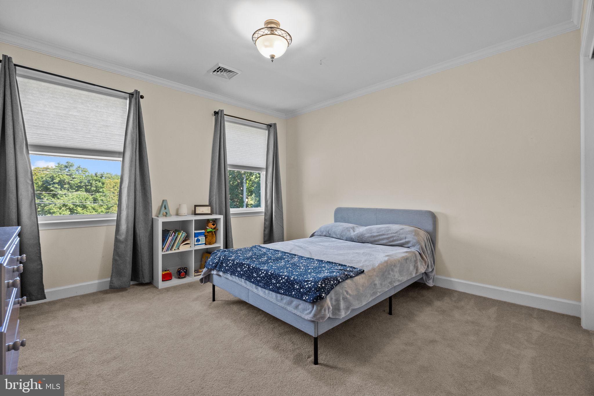 275 West Sandy Ridge Road Doylestown, PA 18901 - Photo 19 of 54 a bedroom with a bed and window