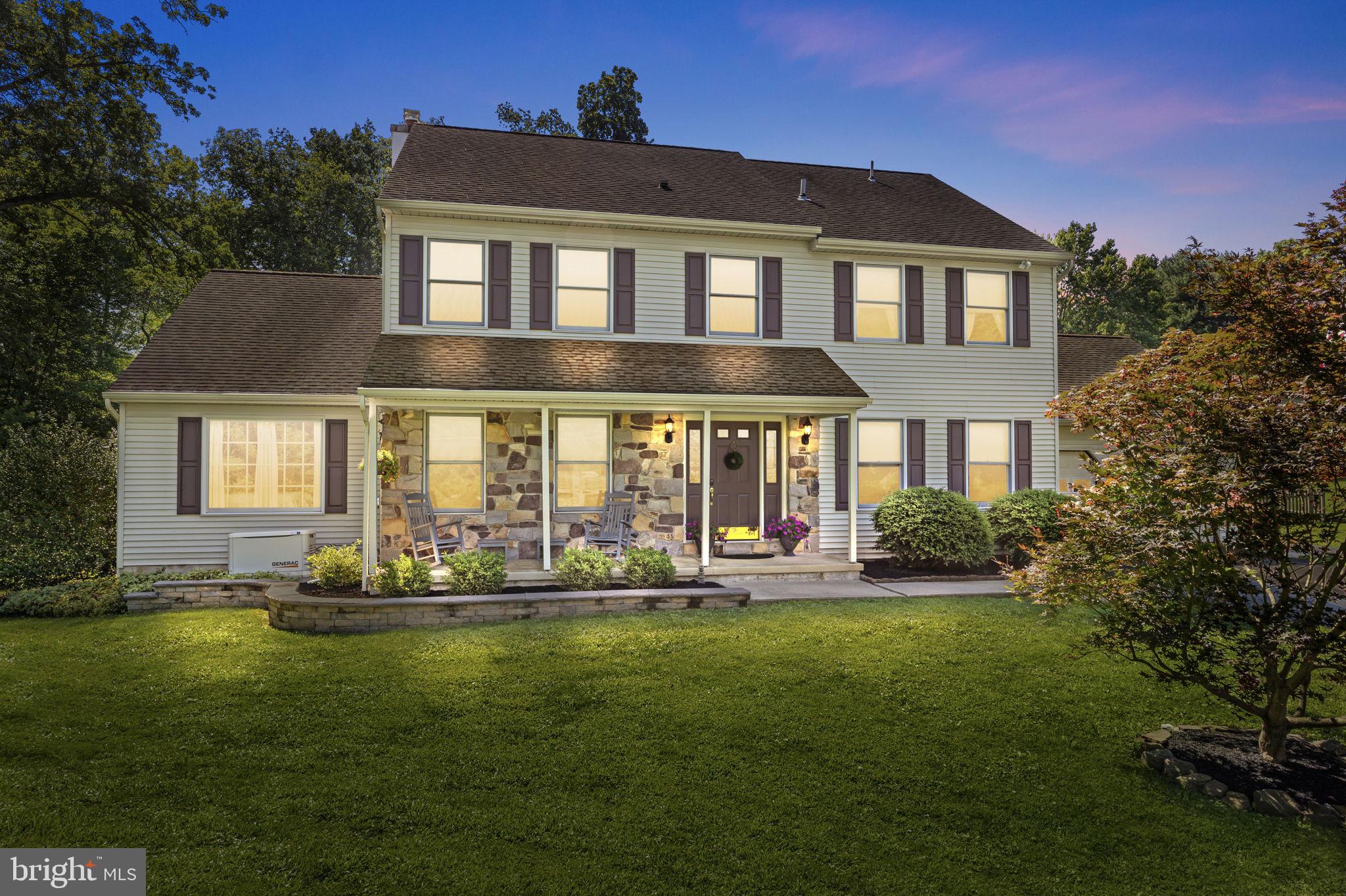 275 West Sandy Ridge Road Doylestown, PA 18901 - Photo 2 of 54 a front view of a house with a yard table and chairs