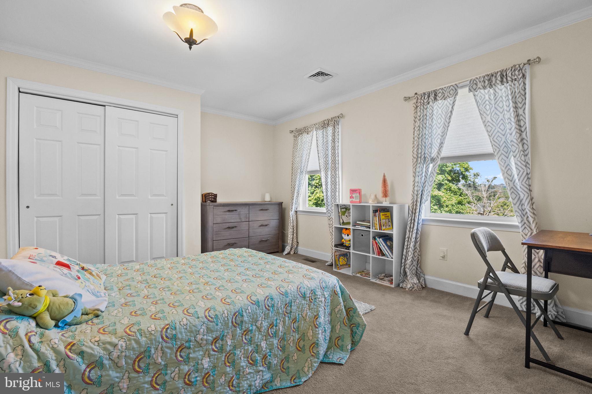 275 West Sandy Ridge Road Doylestown, PA 18901 - Photo 21 of 54 a bedroom with a bed and a window