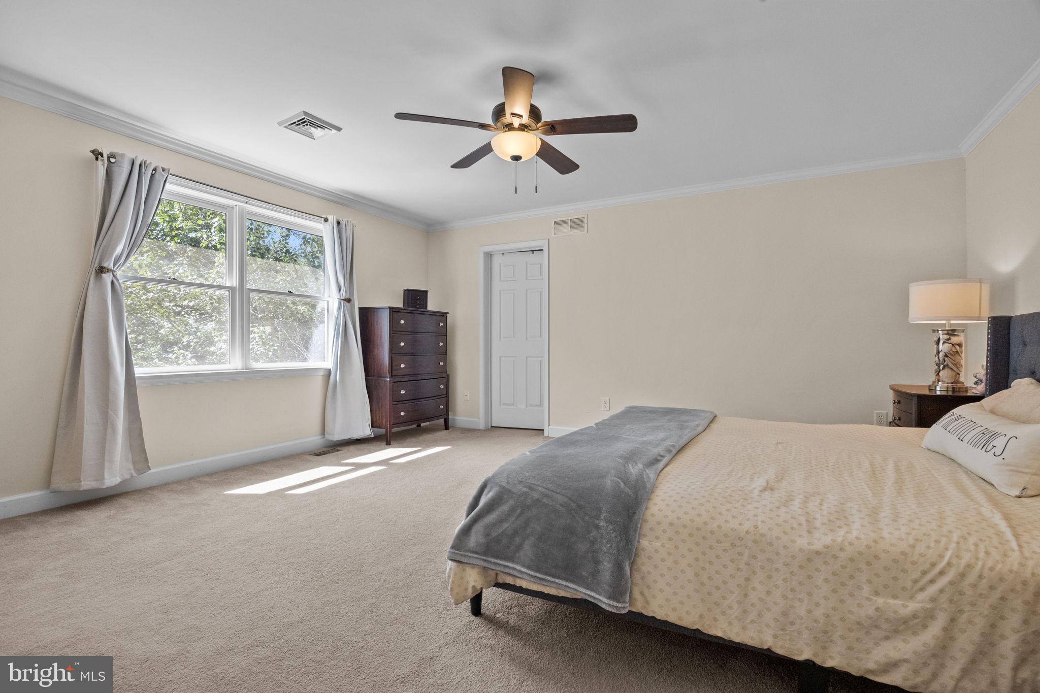 275 West Sandy Ridge Road Doylestown, PA 18901 - Photo 22 of 54 a bedroom with a large bed and a window