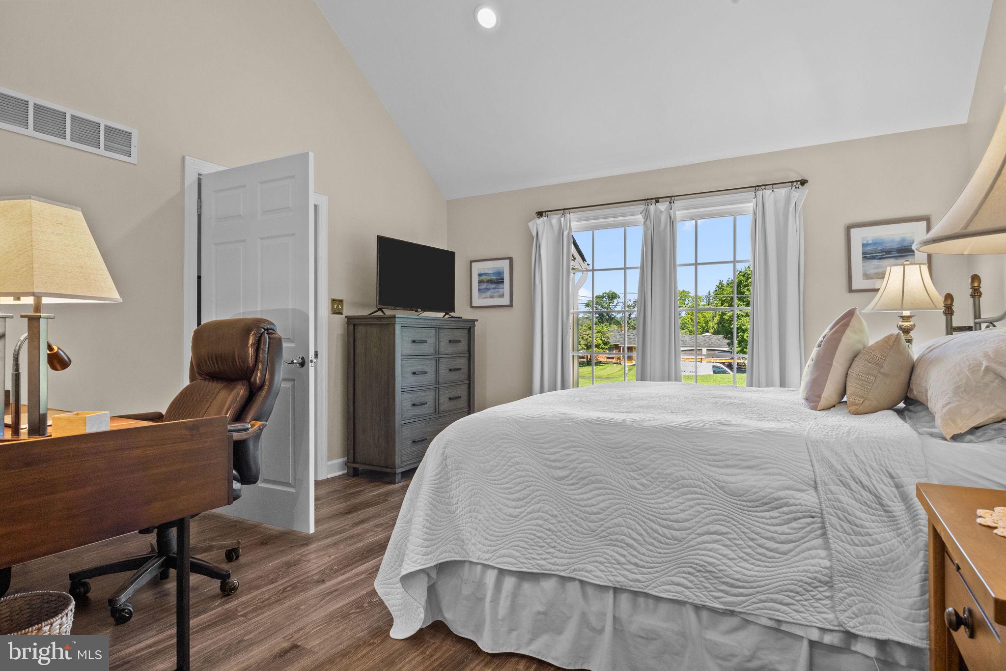 275 West Sandy Ridge Road Doylestown, PA 18901 - Photo 34 of 54 a bedroom with a bed window and a chair