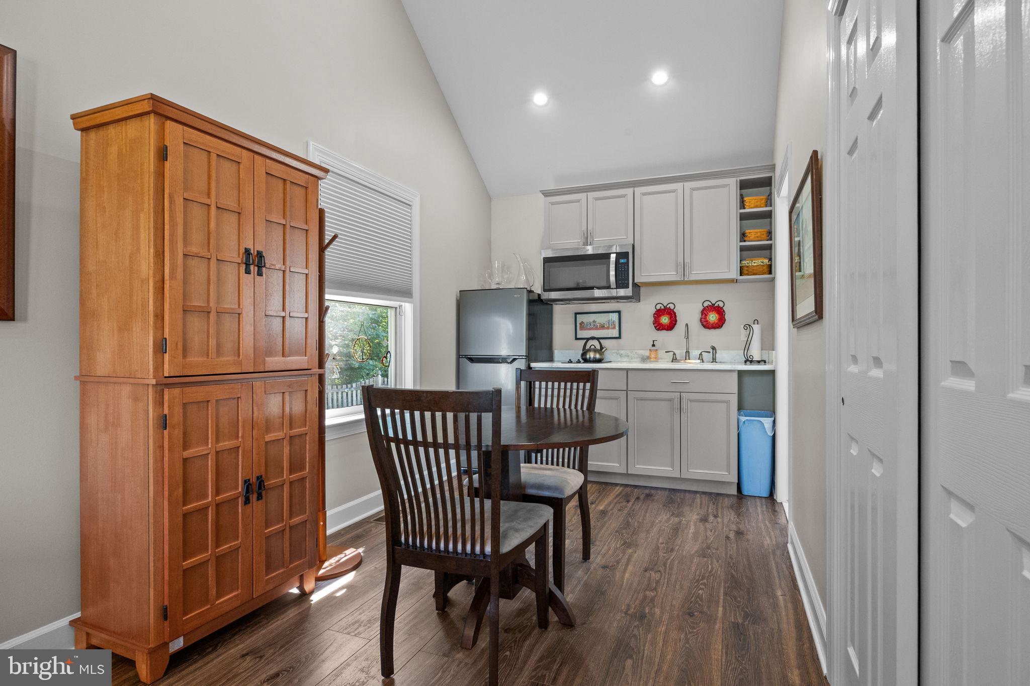 275 West Sandy Ridge Road Doylestown, PA 18901 - Photo 35 of 54 a kitchen with stainless steel appliances granite countertop a refrigerator a microwave oven a sink and dishwasher with wooden floor