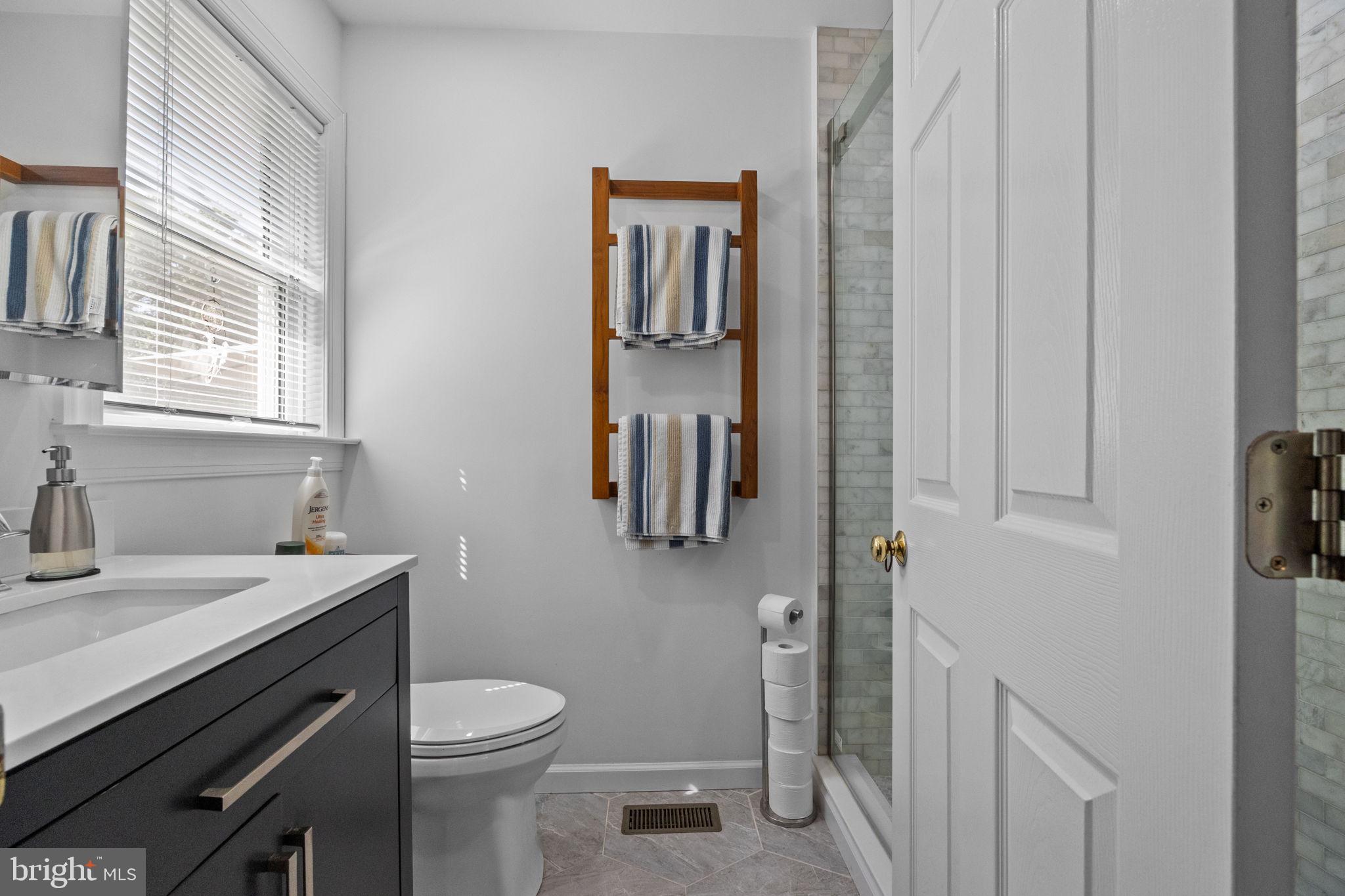 275 West Sandy Ridge Road Doylestown, PA 18901 - Photo 38 of 54 a bathroom with a sink toilet and mirror