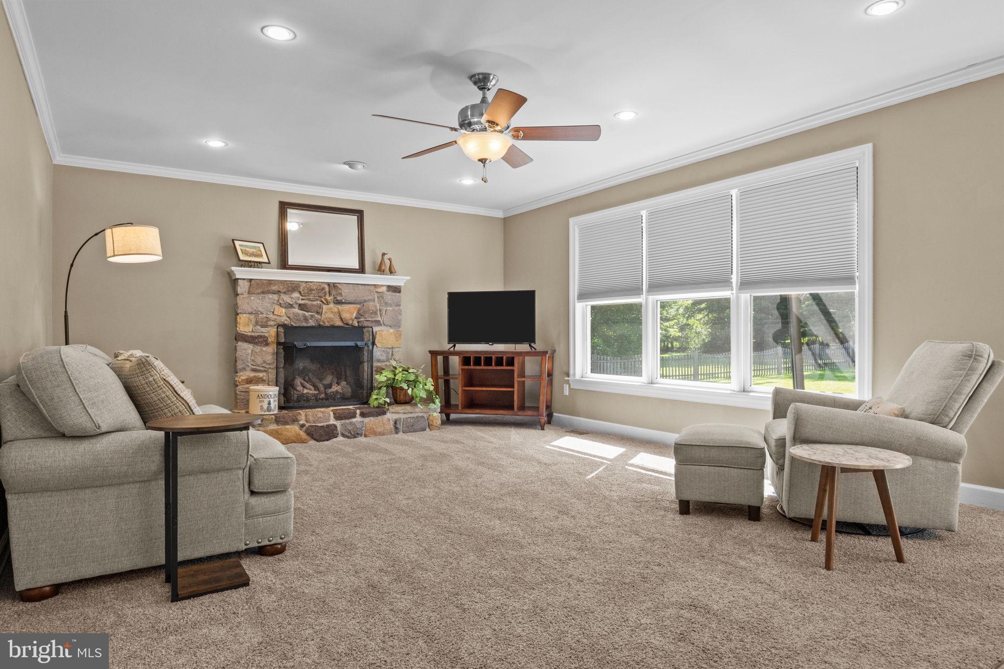 275 West Sandy Ridge Road Doylestown, PA 18901 - Photo 7 of 54 a living room with furniture and a fireplace