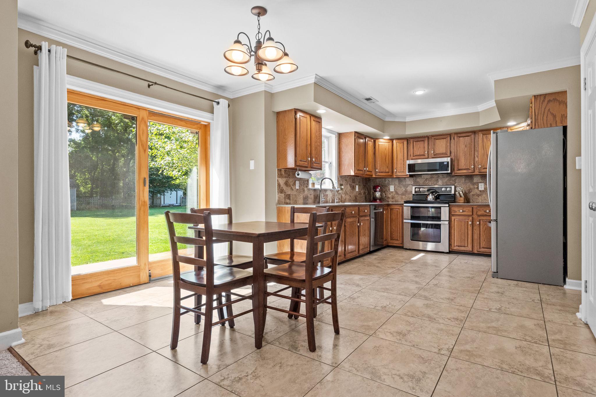 275 West Sandy Ridge Road Doylestown, PA 18901 - Photo 9 of 54 a view of a dining room kitchen and a window