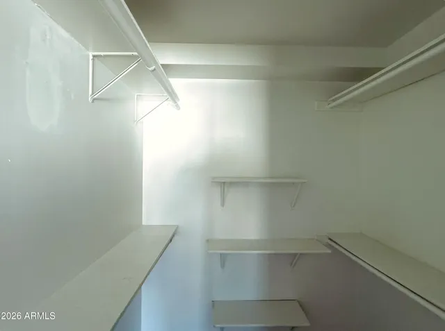 a view of an empty walk in closet