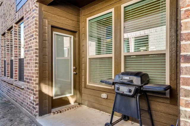 a balcony with table and chairs