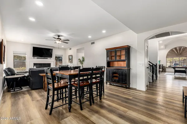 a view of a dining room with furniture window and wooden floor
