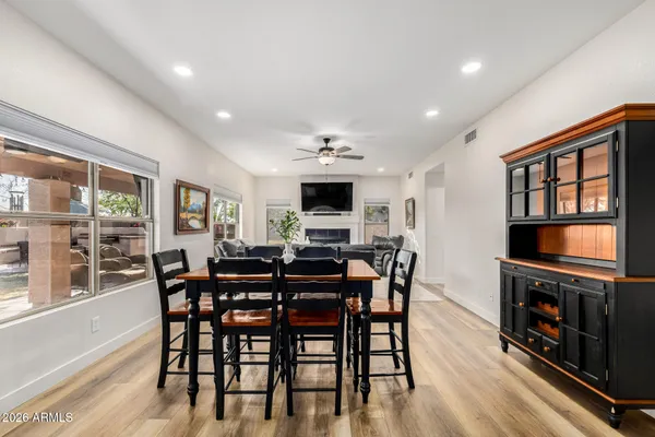 a view of a dining room with furniture window and wooden floor