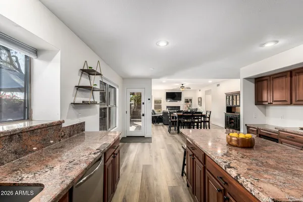 a kitchen with lots of counter top space a sink and appliances