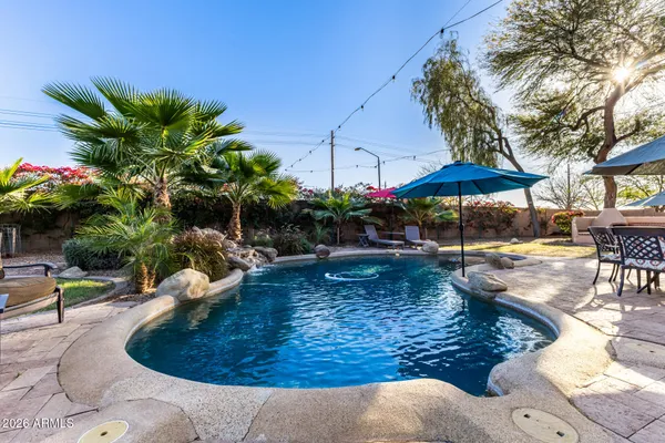 a view of a backyard with sitting area and furniture