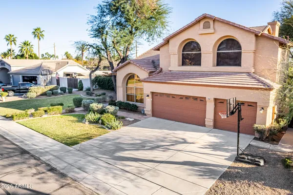 a view of a house with a yard