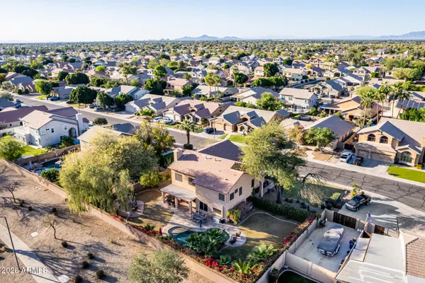 an aerial view of residential houses with outdoor space