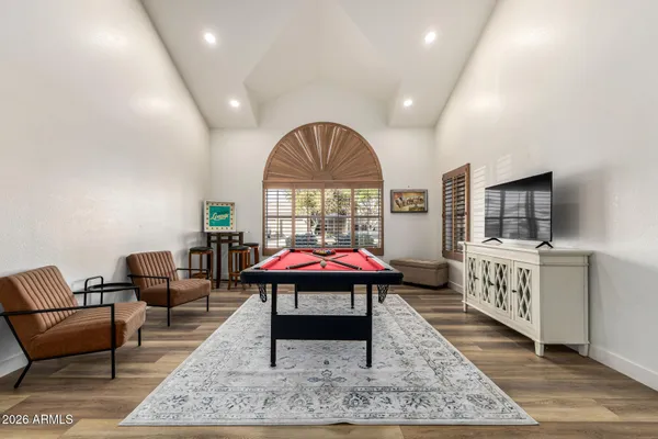 a living room with furniture and a rug