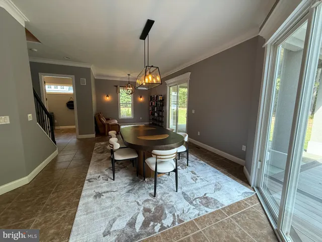 a dining room with a table or chairs and a couch