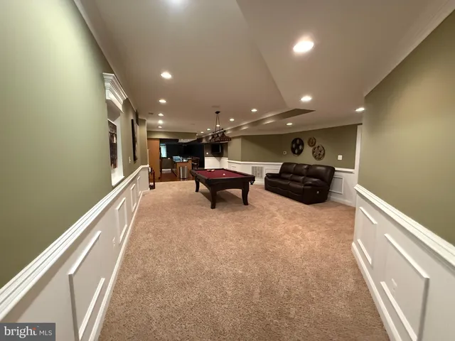 a lobby with furniture and stairs