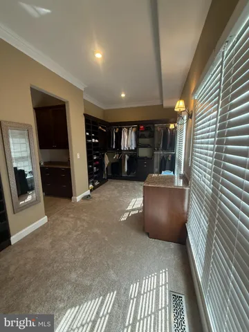 a view of an empty room with a fireplace