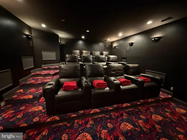 a room with gym equipment and a flat screen tv