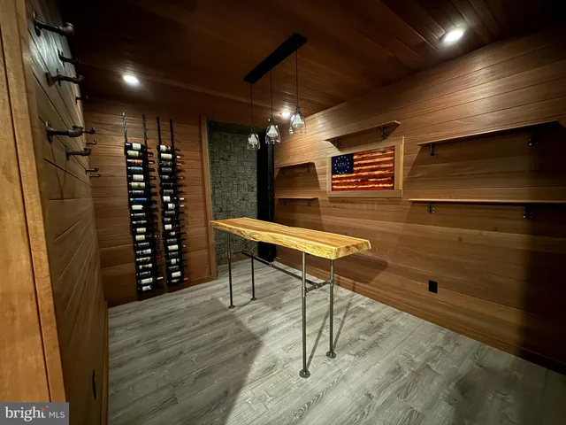 a sitting area with wooden floor