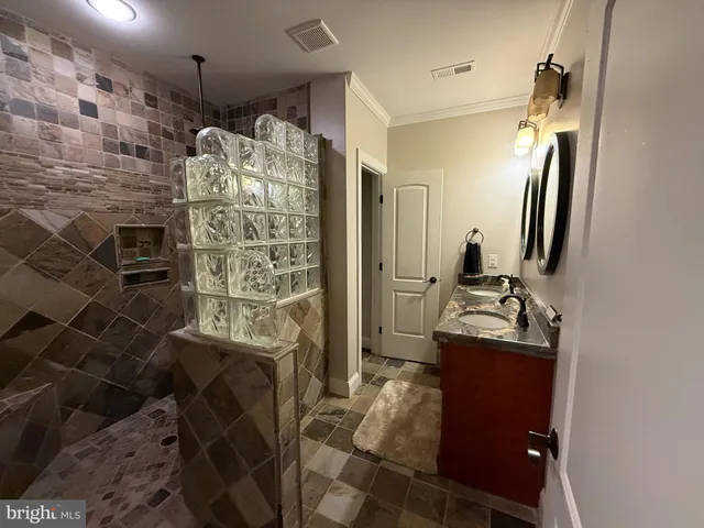 a kitchen with granite countertop a refrigerator and a stove