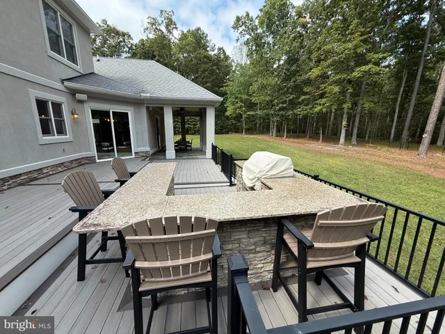 a view of a patio with a table and chairs