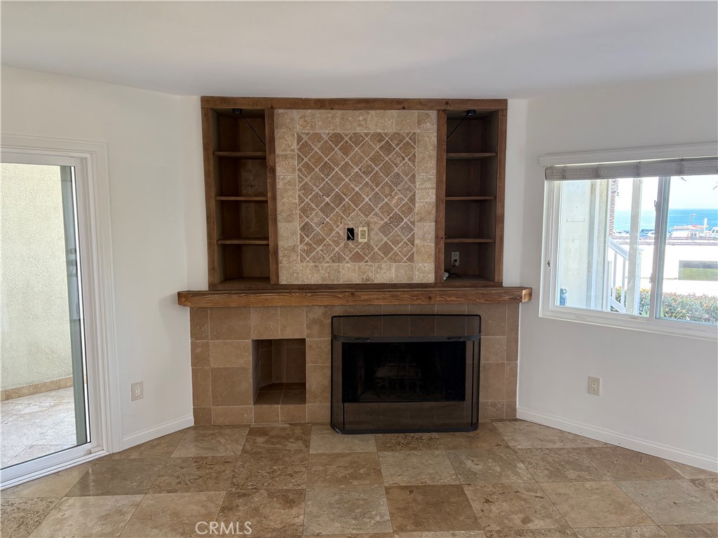34132 Selva Road, Unit 250 Dana Point, CA 92629 - Photo 2 of 25 an empty room with windows