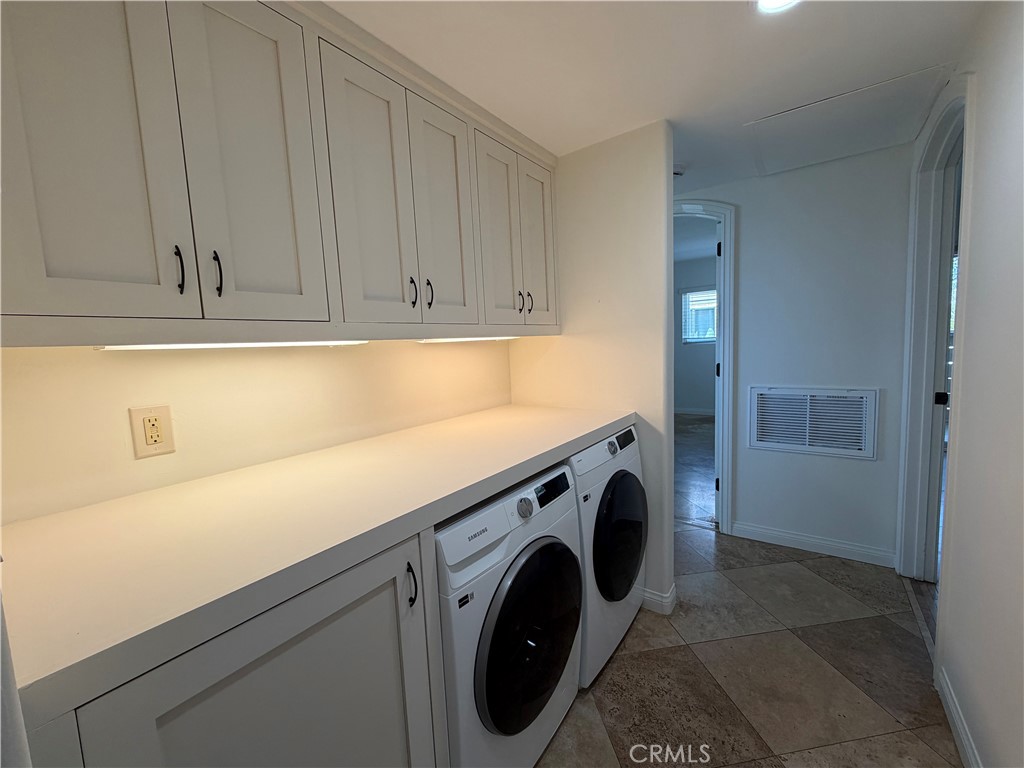 34132 Selva Road, Unit 250 Dana Point, CA 92629 - Photo 9 of 25 a utility room with dryer and washer