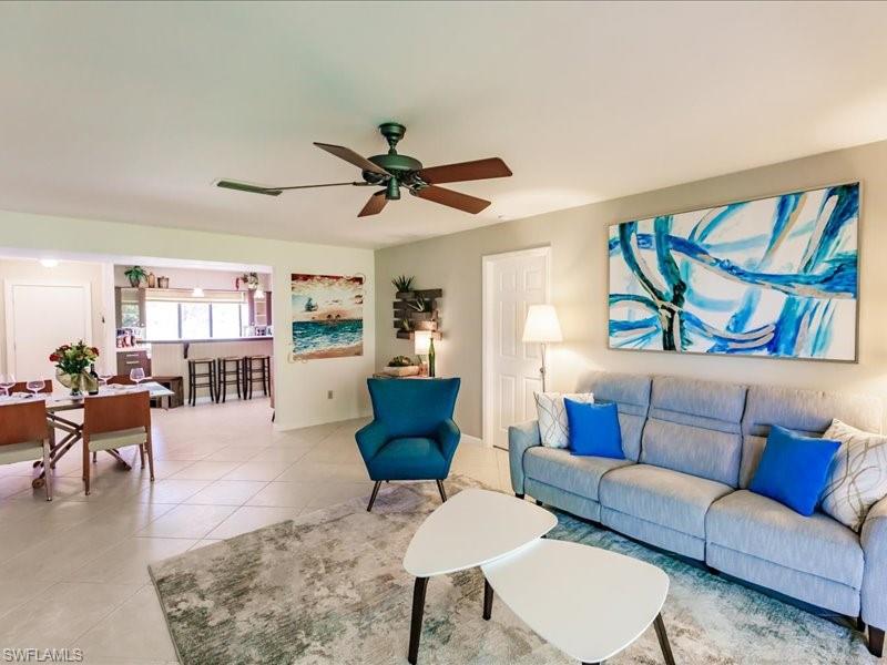 910 Vanderbilt Beach Road, Unit 524W Naples, FL 34108 - Photo 3 of 44 Tiled living room with ceiling fan