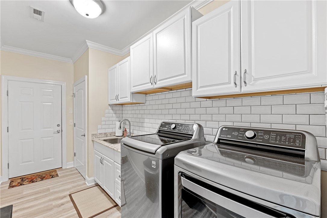 119 Turnberry Road Anderson, SC 29621 - Photo 23 of 50 This thoughtfully designed laundry area offers practicality and ample storage.