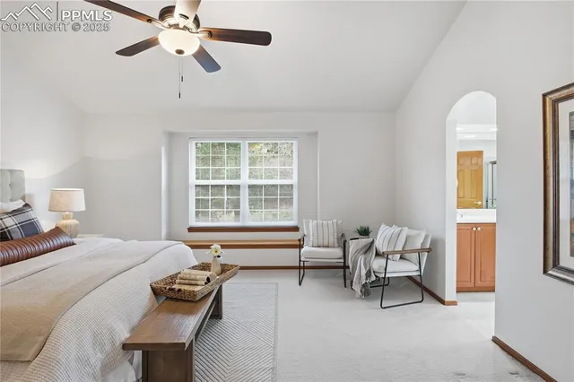 a bedroom with furniture and a window