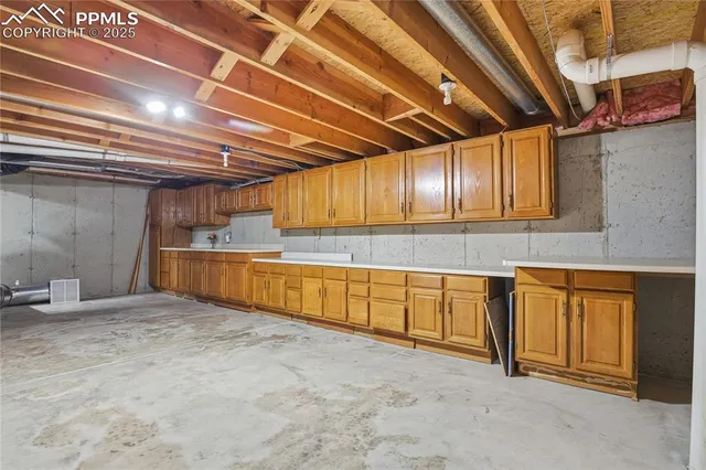 a group of people sitting in front of a house