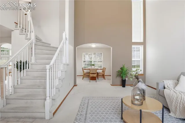 a lobby with furniture and rug