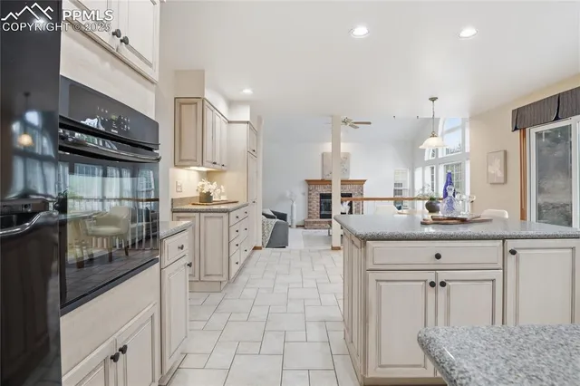 a kitchen with stainless steel appliances granite countertop a sink and cabinets