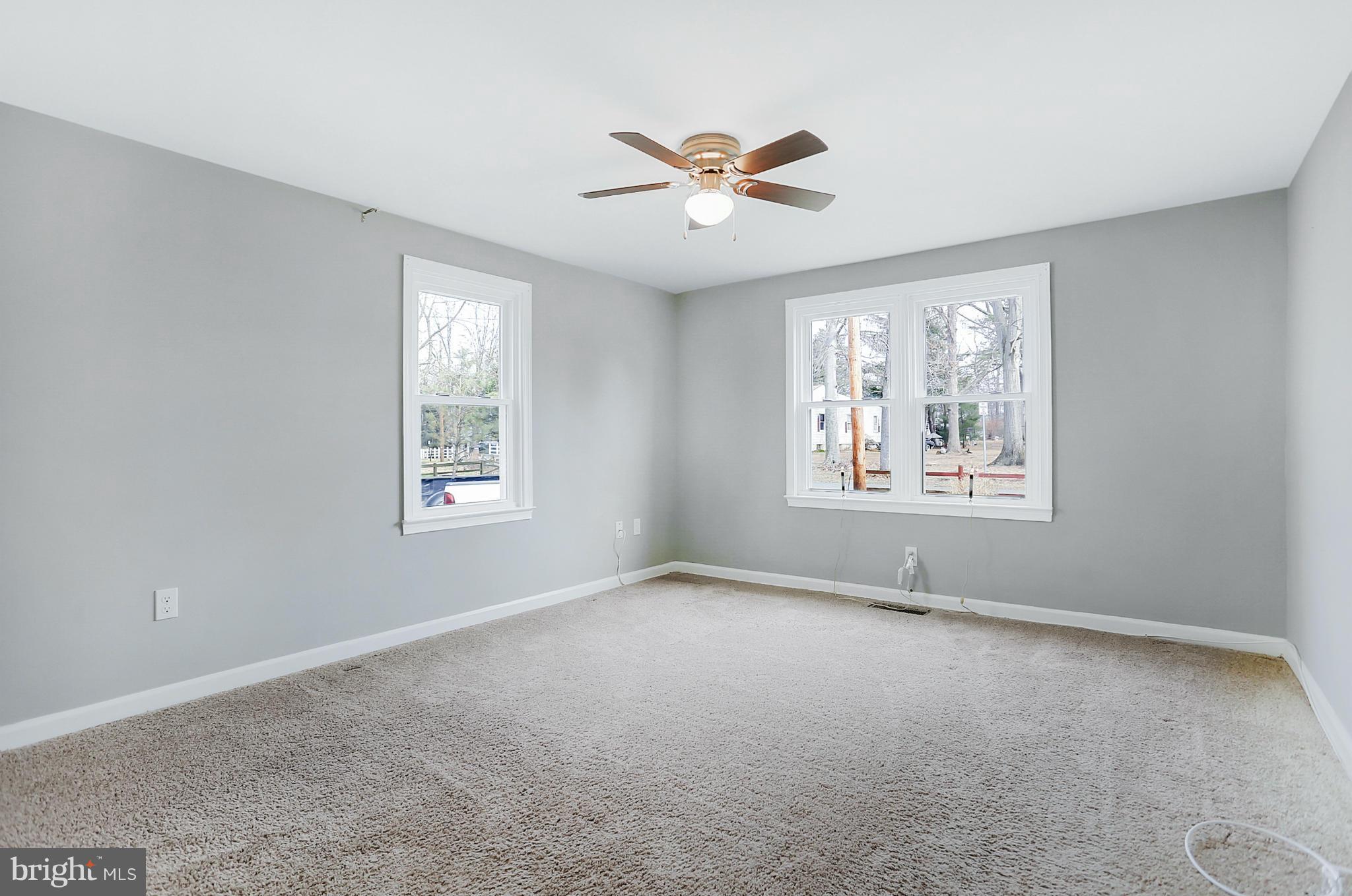 220 W Road Baltimore, MD 21221 - Photo 11 of 30 an empty room with windows and fan