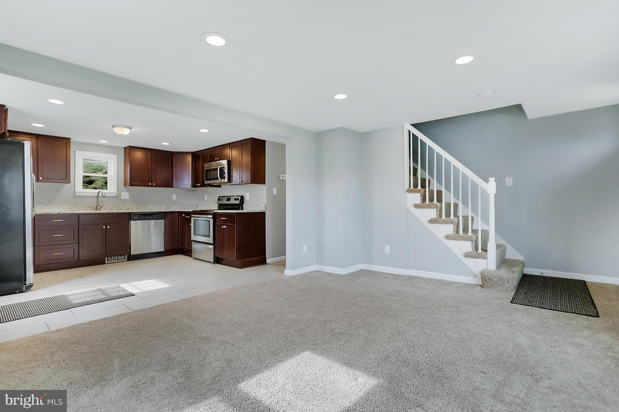 220 W Road Baltimore, MD 21221 - Photo 5 of 30 a kitchen with stainless steel appliances a refrigerator and a microwave